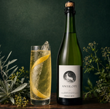 Domaine des Grottes Antilope bottle with a tall glass served over ice and lemon